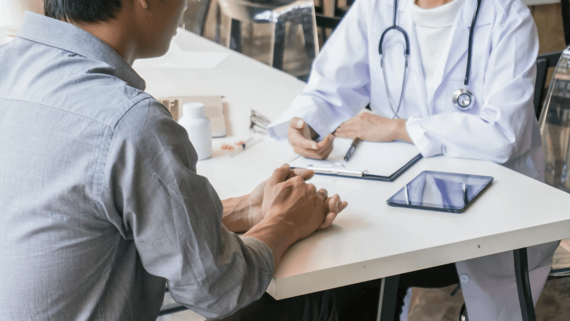 A doctor holding a phone